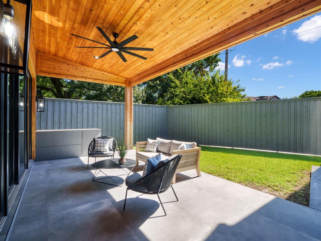 4010 Sperry Street Dallas, TX 75214 - Photo 37 of 40 Fenced backyard with a patio area, a ceiling fan, and outdoor seating
