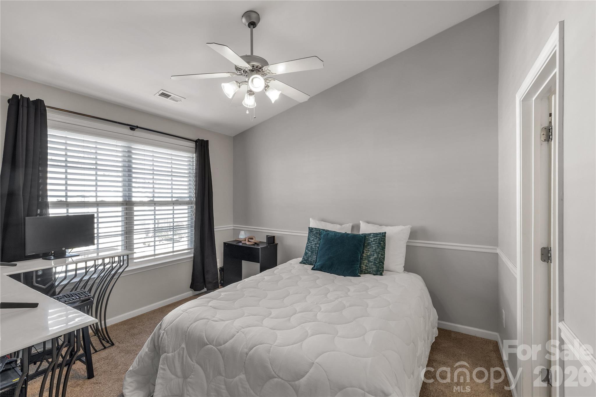 960 Copperstone Lane Fort Mill, SC 29708 - Photo 15 of 29 a bedroom with a bed and a table with chair