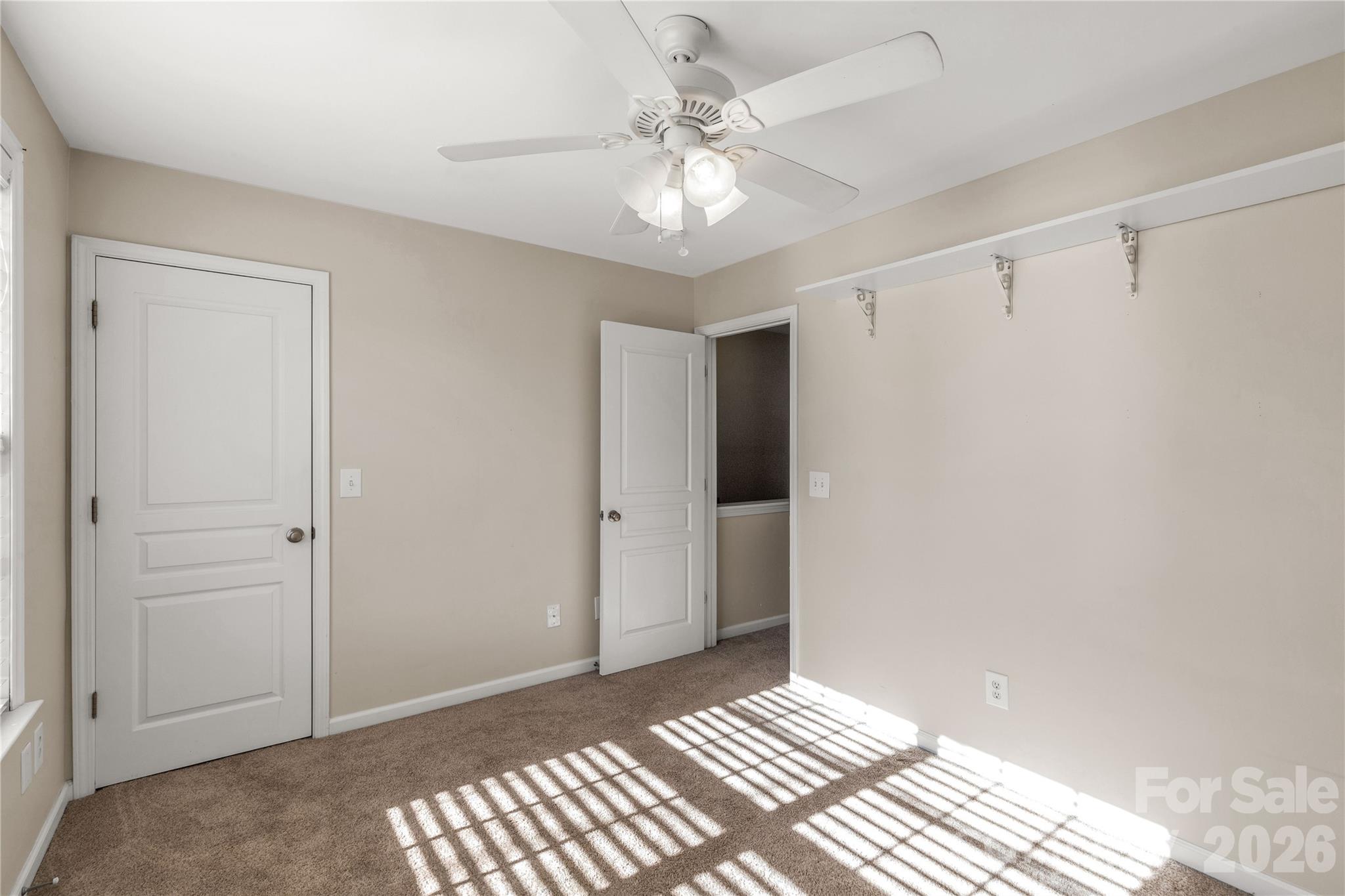 960 Copperstone Lane Fort Mill, SC 29708 - Photo 19 of 29 a view of a bedroom with a sink and a chandelier fan