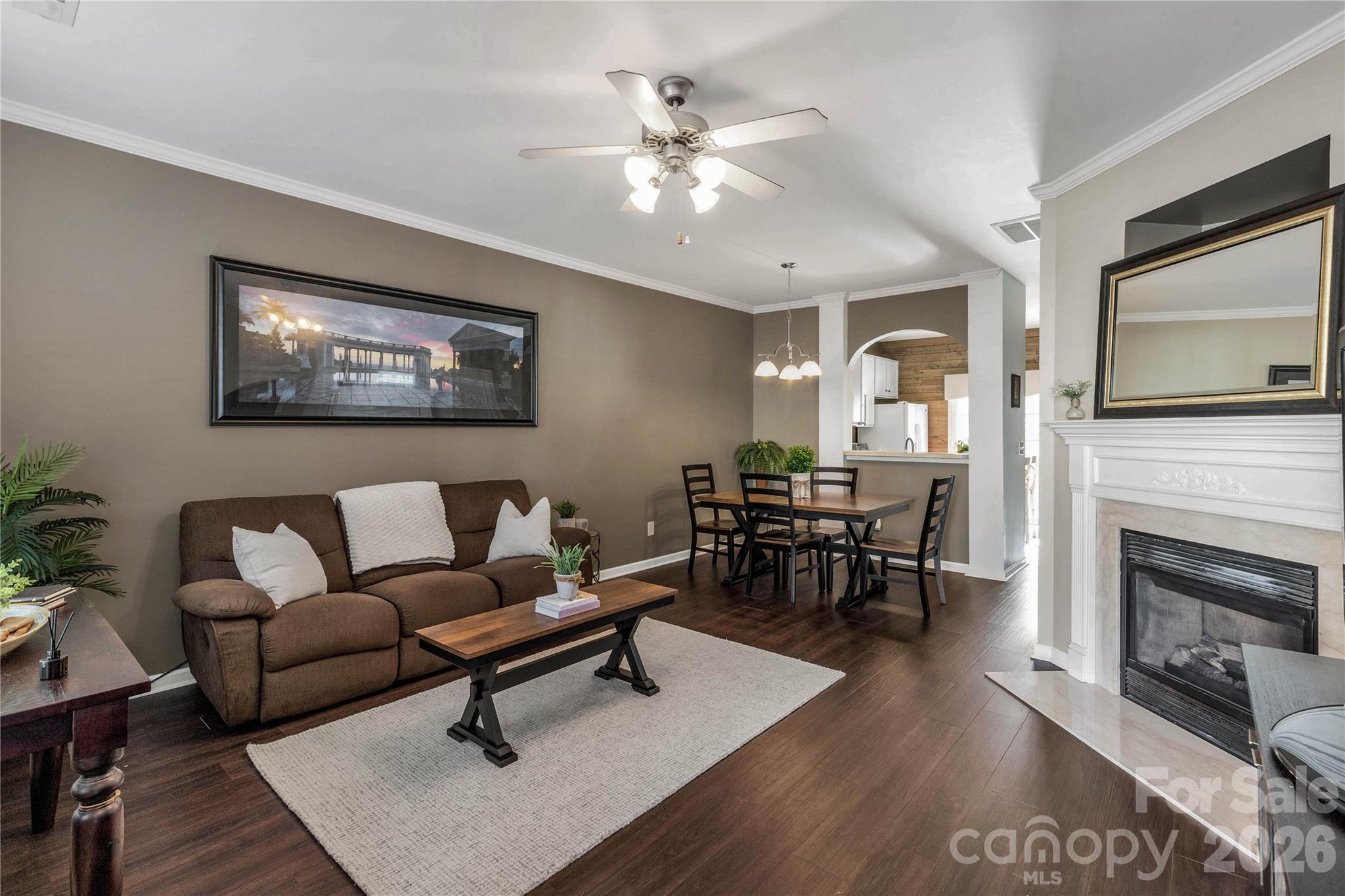 960 Copperstone Lane Fort Mill, SC 29708 - Photo 5 of 29 a living room with furniture a fireplace and wooden floor