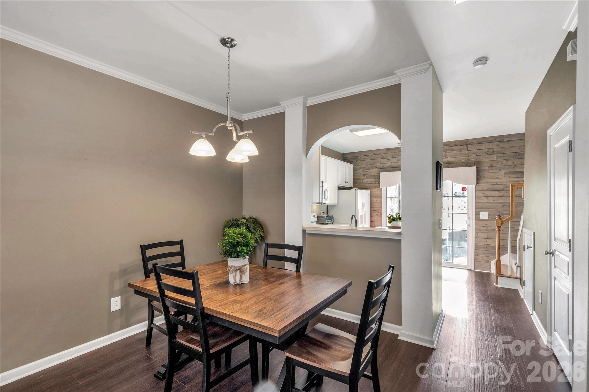 960 Copperstone Lane Fort Mill, SC 29708 - Photo 7 of 29 a dining room with furniture a chandelier and wooden floor