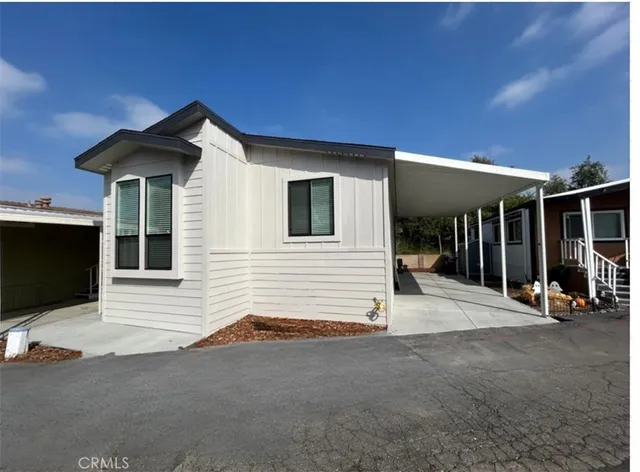 a view of house with outdoor space and porch area