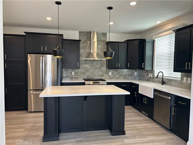 a large kitchen with stainless steel appliances kitchen island a large island in the center