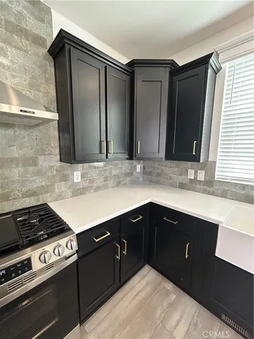 a kitchen with a sink and cabinets