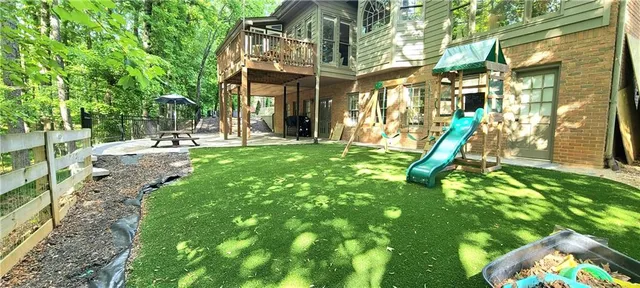 a view of a house with a backyard