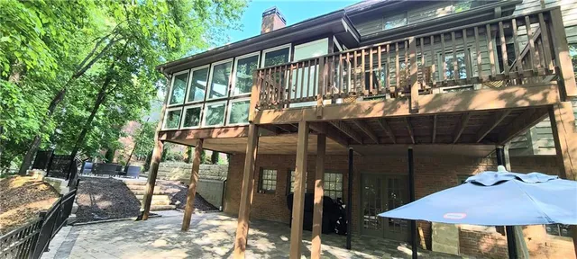 a view of house with outdoor seating area