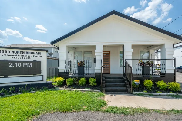 a picture of a bench in front of a wall