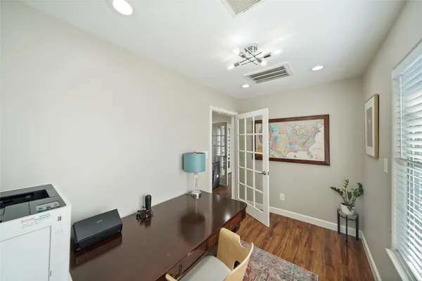 a workspace with furniture and wooden floor