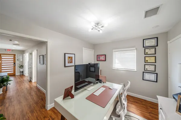 a workspace with furniture and a window