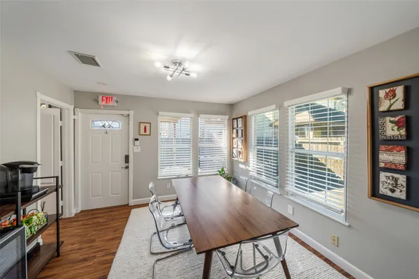 a view of a livingroom with furniture and hardwood floor