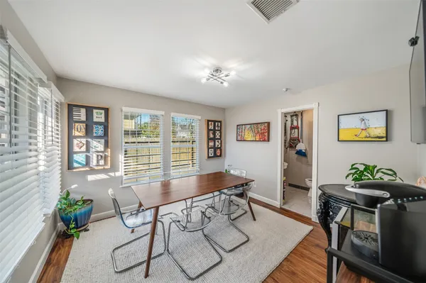 a workspace with furniture and a potted plant