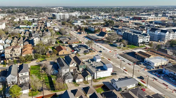 an aerial view of residential houses with outdoor space