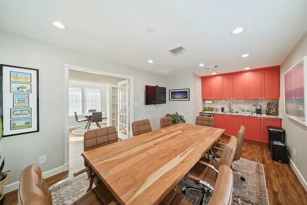 a living room with dining table furniture a dining table and window