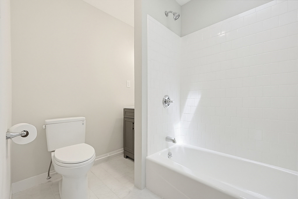 10 Water Street Natick, MA 01760 - Photo 23 of 35 a bathroom with a toilet and a bathtub