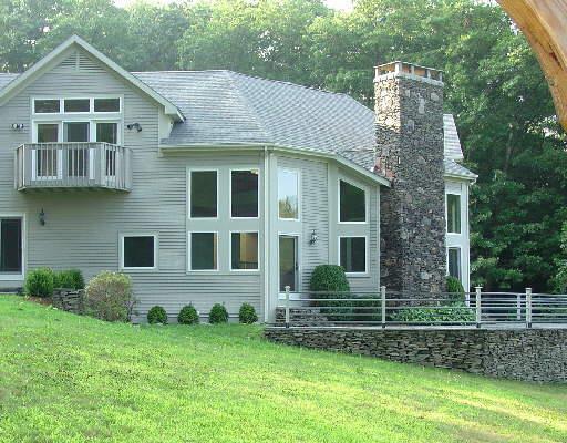 34 Transylvania Road Roxbury, CT 06783 - Photo 1 of 1 a front view of a house with a yard