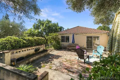 a view of a yard with a tree