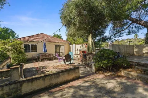 a view of a backyard with sitting area