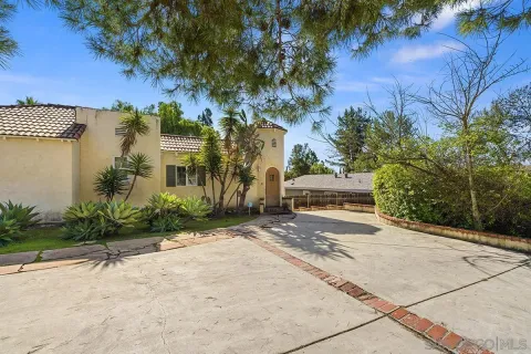 a view of a street with a building in the background
