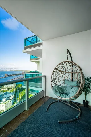 a view of staircase with a table and a potted plant