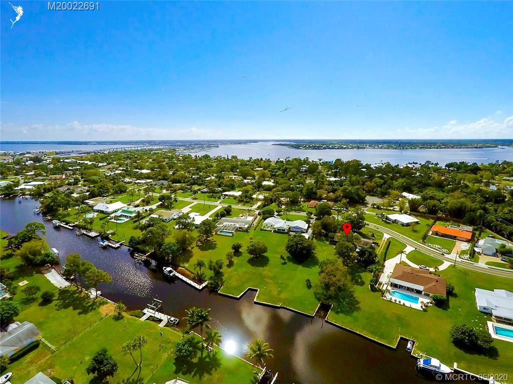 774 Northwest Spruce Ridge Drive Stuart, FL 34994 - Photo 4 of 10 an aerial view of residential houses with outdoor space