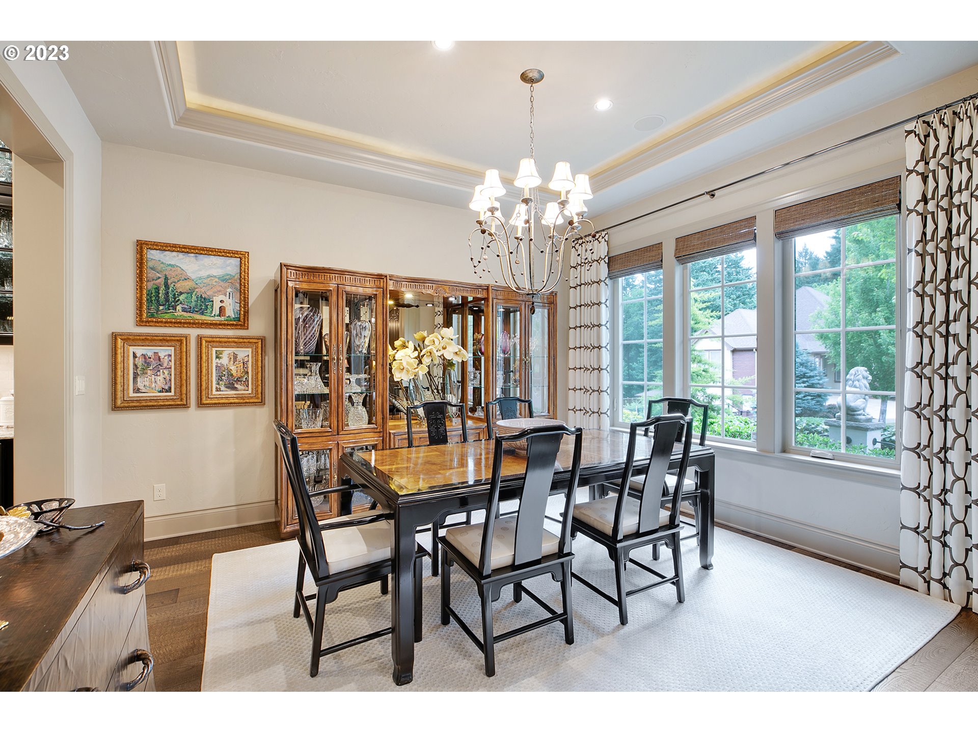 14051 155th Terrace Portland, OR 97224 - Photo 18 of 48 a dining room with furniture a chandelier and wooden floor