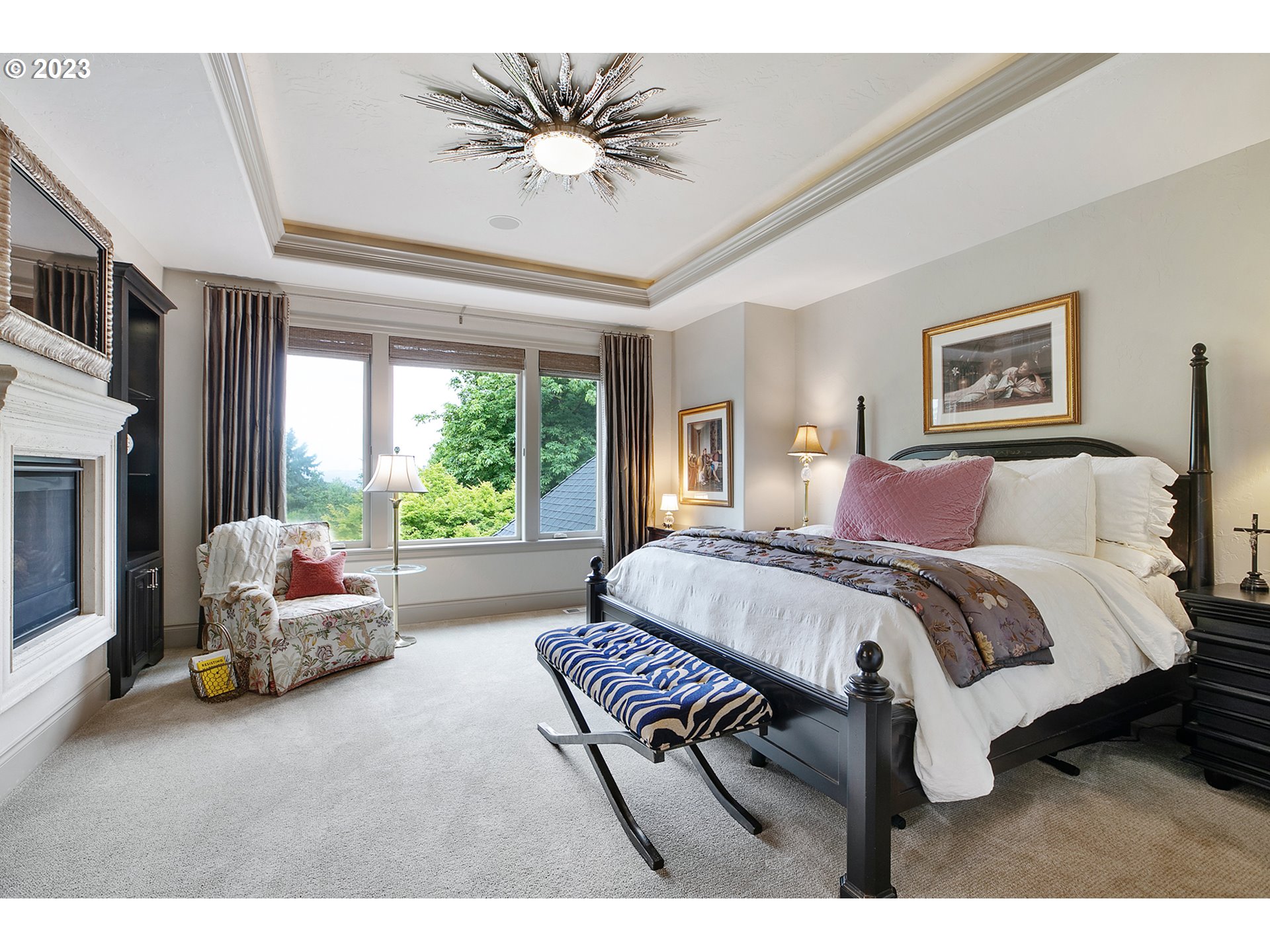 14051 155th Terrace Portland, OR 97224 - Photo 23 of 48 a spacious bedroom with a bed and a chandelier