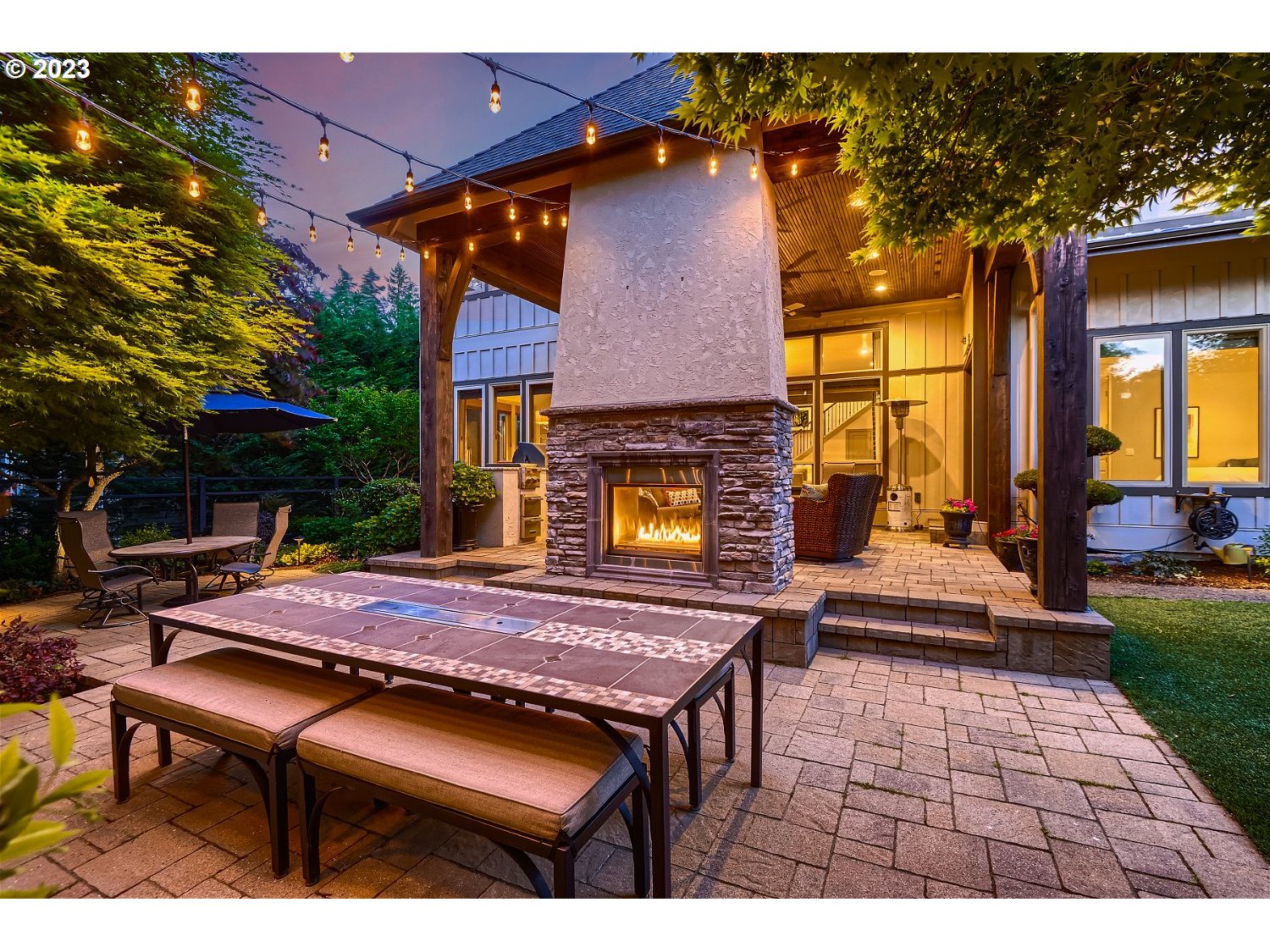 14051 155th Terrace Portland, OR 97224 - Photo 47 of 48 a table and chairs in front of a house