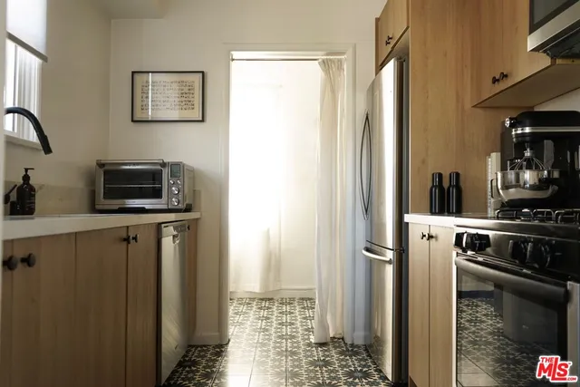 a bedroom with a bed and a night stand