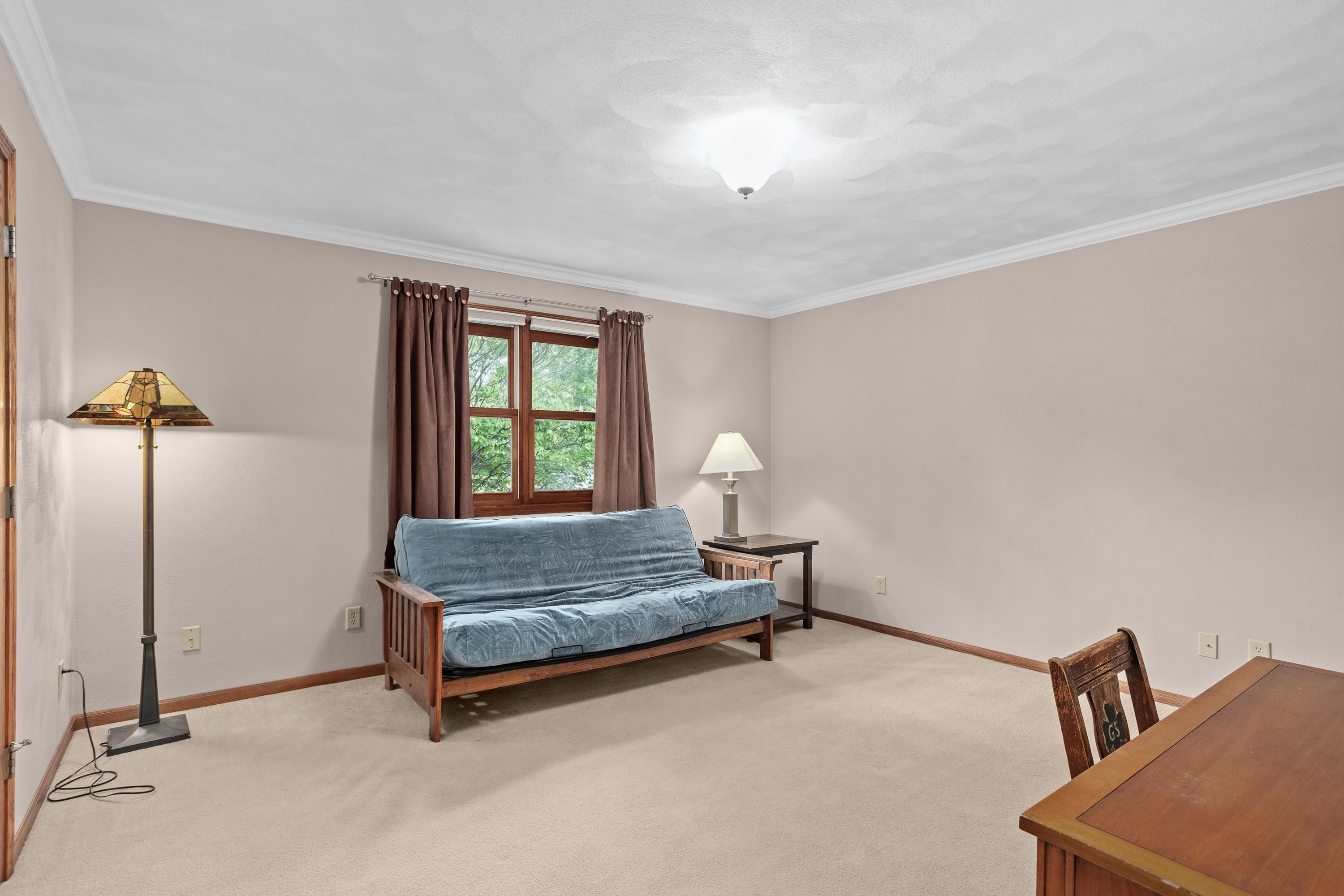 13294 Weatherfield Way Roscoe, IL 61073 - Photo 14 of 38 a living room with a bed furniture and a window