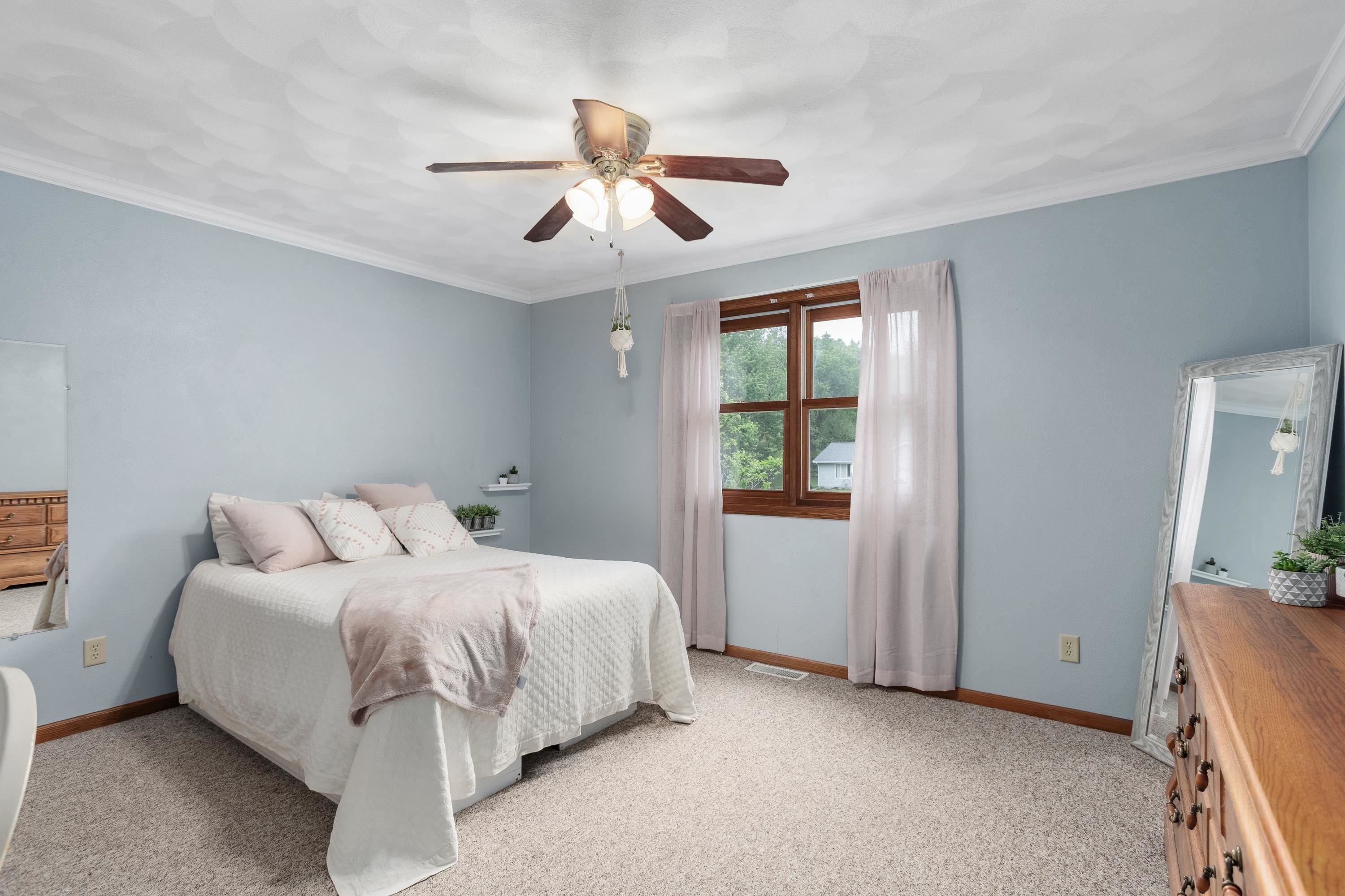 13294 Weatherfield Way Roscoe, IL 61073 - Photo 17 of 38 a bedroom with a bed and a chandelier