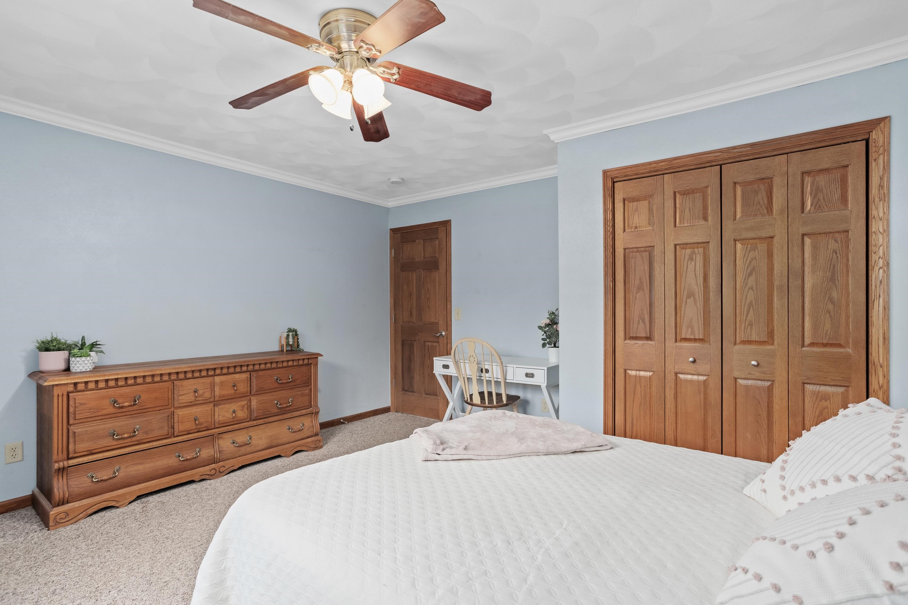 13294 Weatherfield Way Roscoe, IL 61073 - Photo 18 of 38 a bedroom with a bed and wooden floor