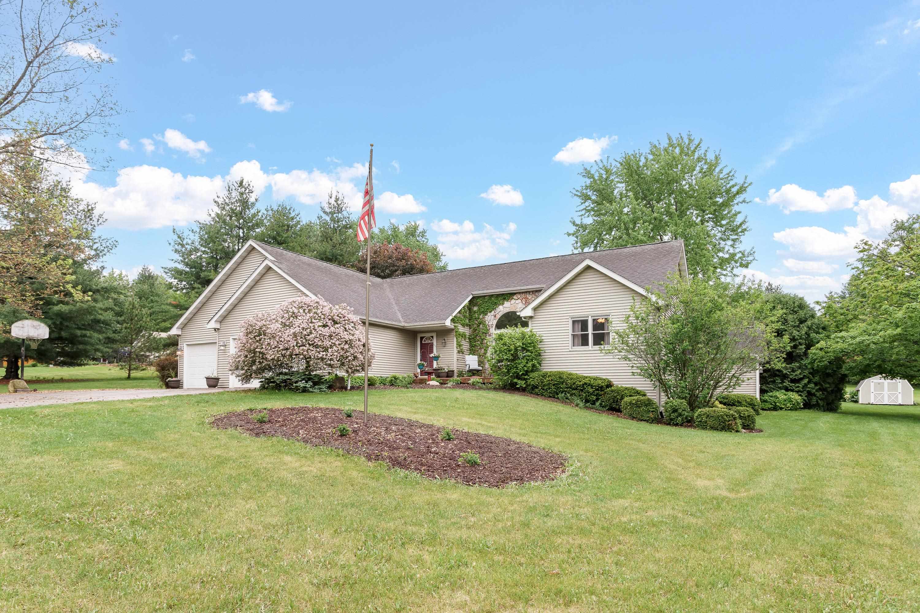 13294 Weatherfield Way Roscoe, IL 61073 - Photo 2 of 38 a view of a house with a yard and potted plants