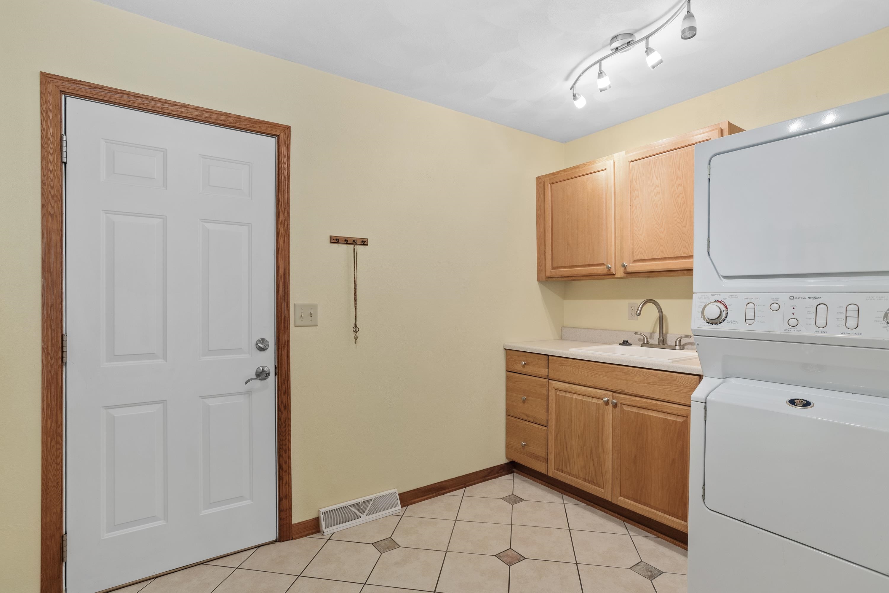 13294 Weatherfield Way Roscoe, IL 61073 - Photo 24 of 38 a spacious bathroom with a sink a mirror and a shower