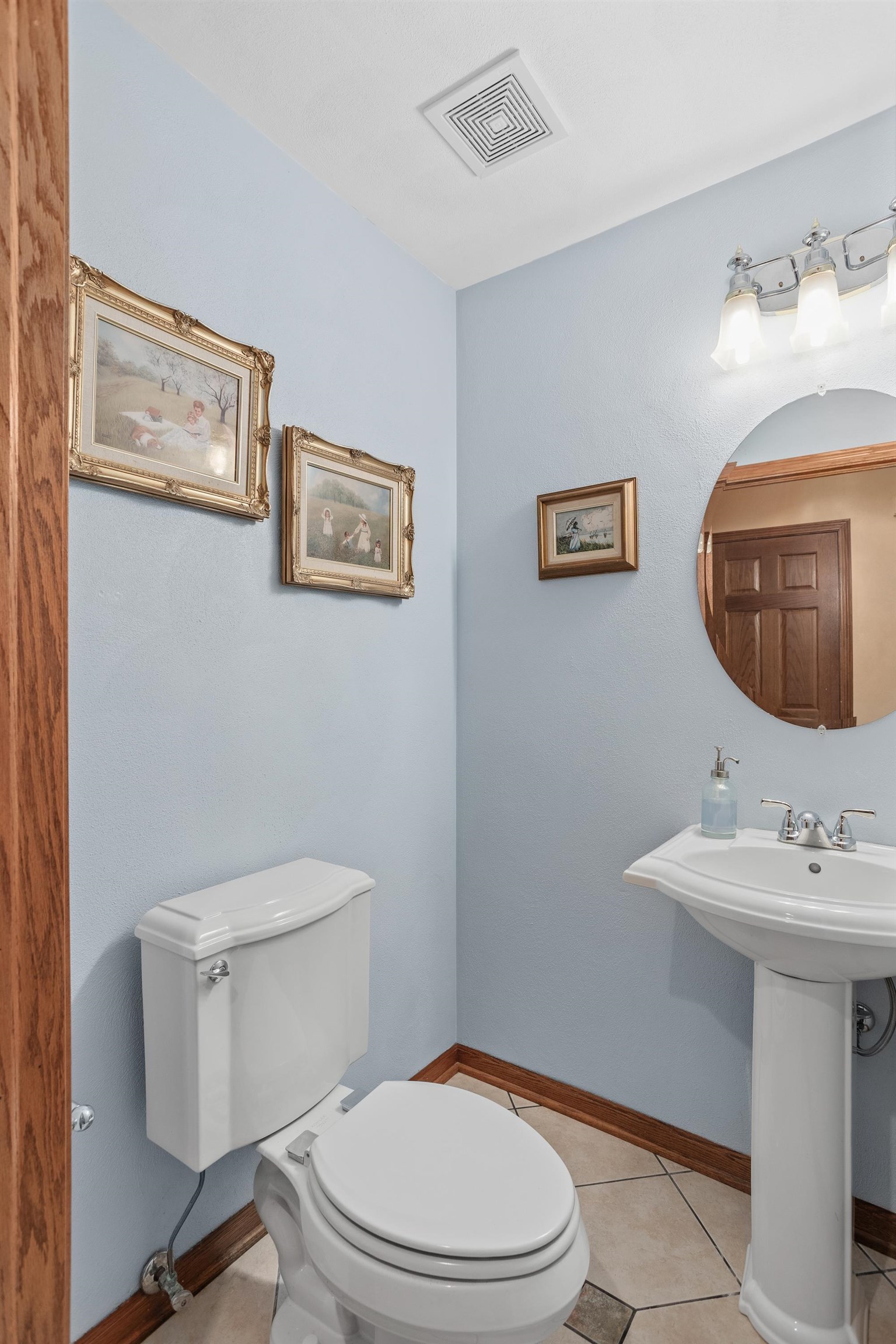 13294 Weatherfield Way Roscoe, IL 61073 - Photo 25 of 38 a white toilet sitting next to a bathroom sink