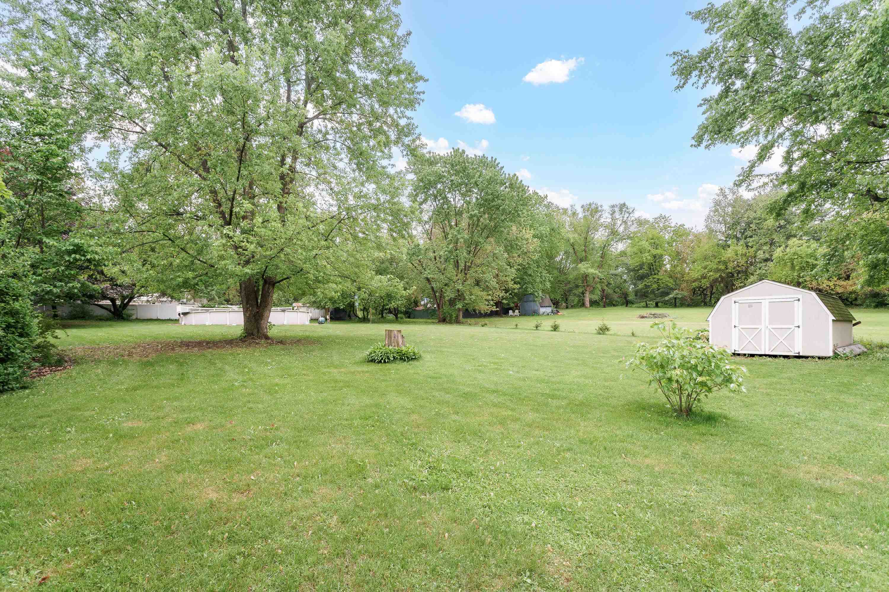 13294 Weatherfield Way Roscoe, IL 61073 - Photo 9 of 38 a backyard of a house with lots of green space