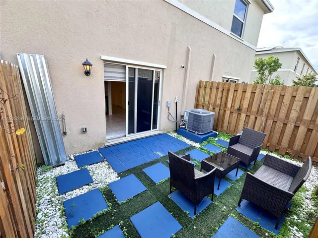 an empty room with closet and windows