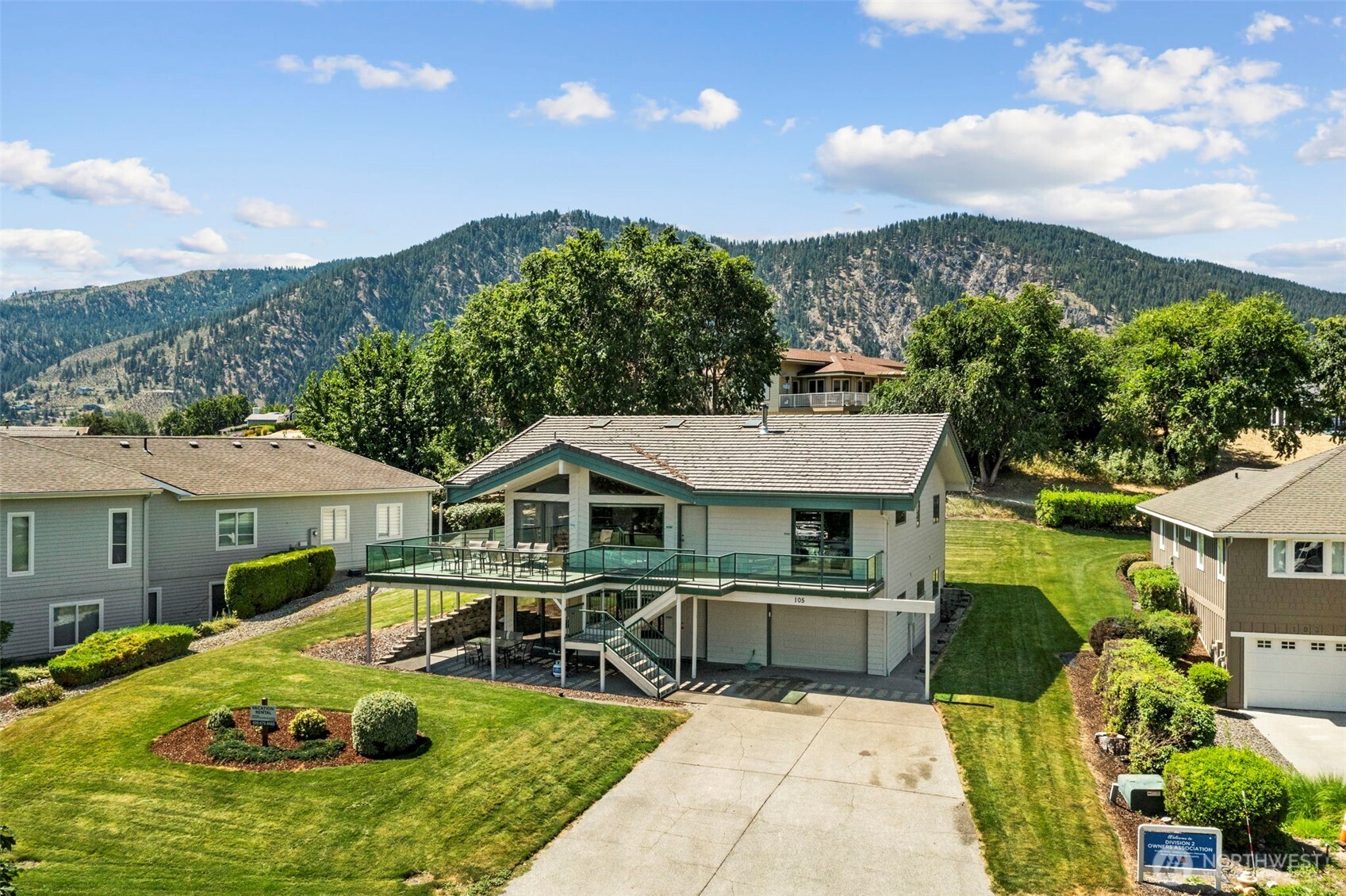 105 Chelan View Drive Manson, WA 98831 - Photo 1 of 40 a view of a house with pool and chairs
