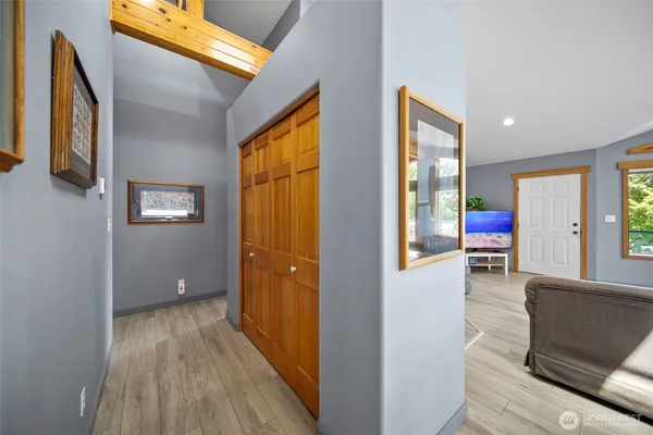 a view of a hallway view with wooden floor and staircase