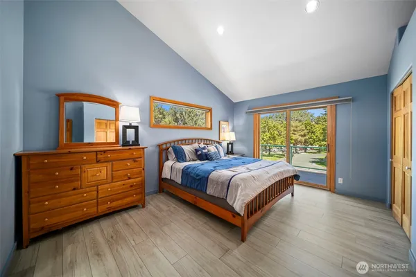 a bedroom with a bed and a dresser