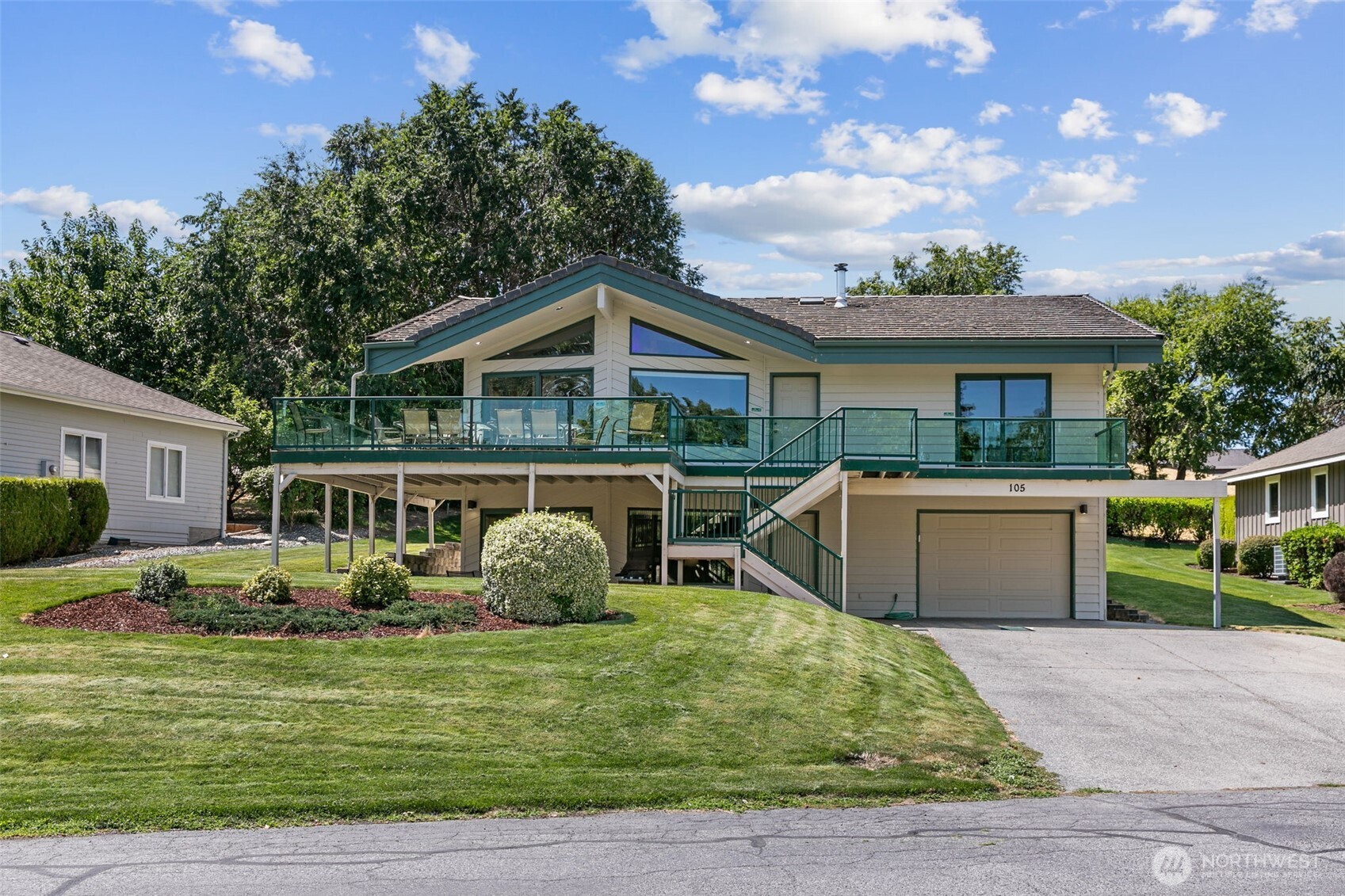 105 Chelan View Drive Manson, WA 98831 - Photo 2 of 40 a front view of a house with garden