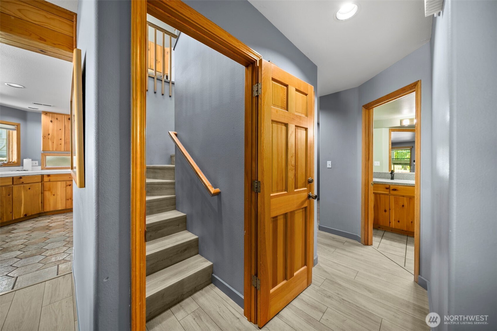 105 Chelan View Drive Manson, WA 98831 - Photo 23 of 40 a view of a hallway with wooden floor and staircase