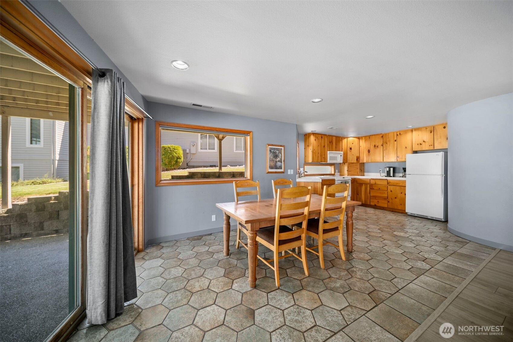 105 Chelan View Drive Manson, WA 98831 - Photo 24 of 40 a dining room with furniture and a floor to ceiling window