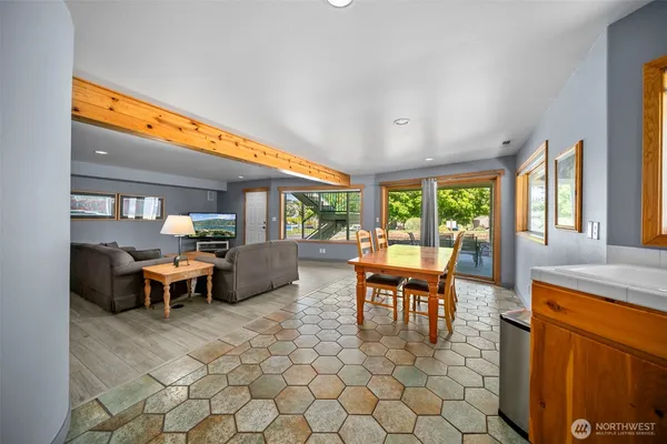 a view of a dining room with furniture window and outside view