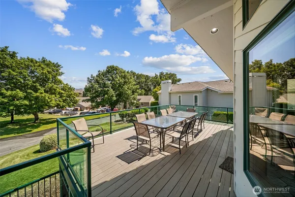 a view of a chairs and table on the wooden floor
