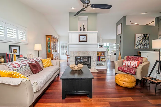a living room with furniture and a fireplace