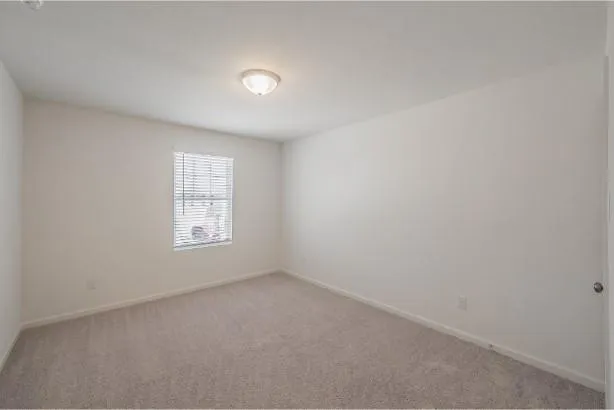 a bathroom with a toilet a sink a mirror a bathtub and vanity