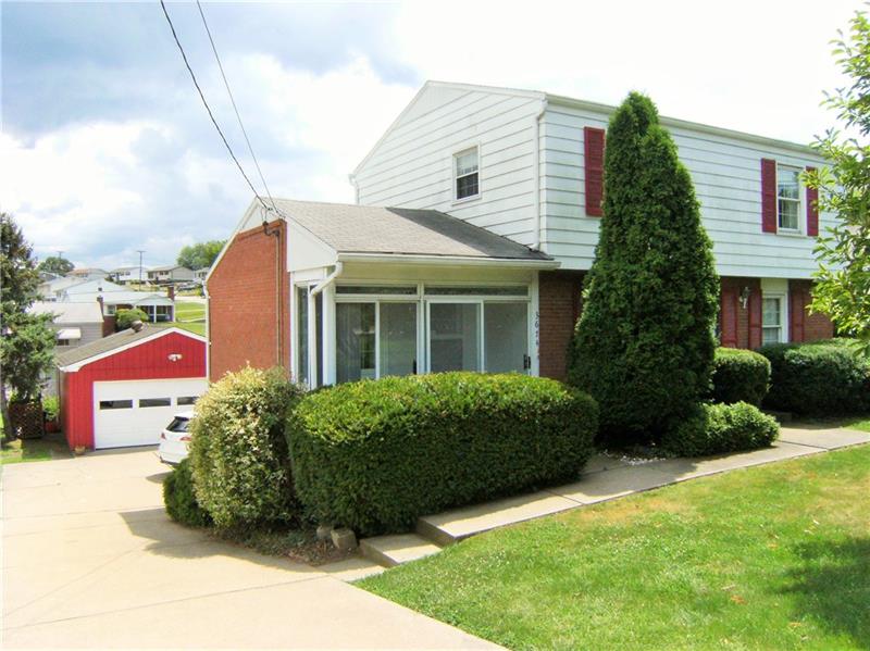 Another View From The Street Showing Separate Entrance Porch And Detached Garage