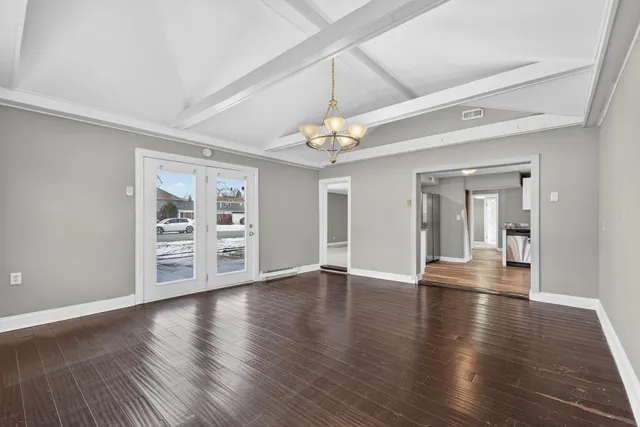 a view of a livingroom with wooden floor