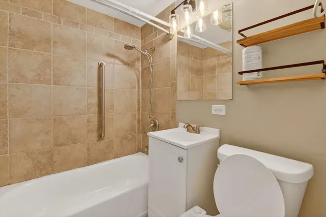 a bathroom with a toilet a sink and bathtub