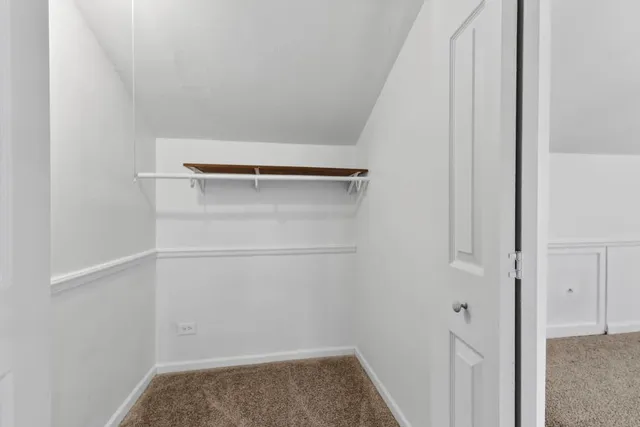 a view of storage and utility room with racks on the wall